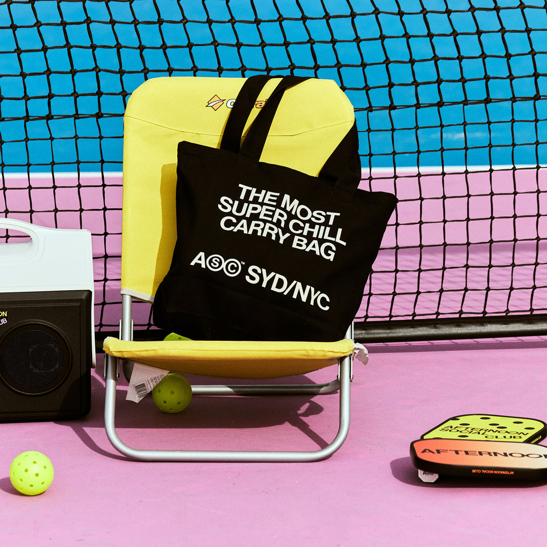 the tote bag position on a chair on the pickleball court