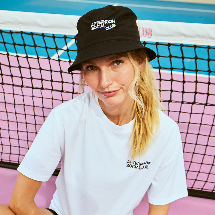Female wearing Afternoon Social Club bucket hat