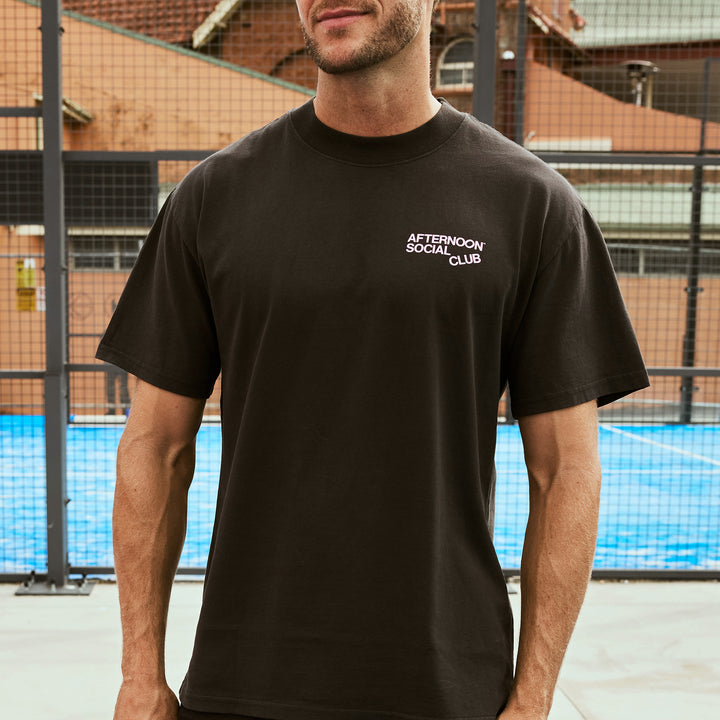 Man wearing Afternoon Social Club heavy tee in black.