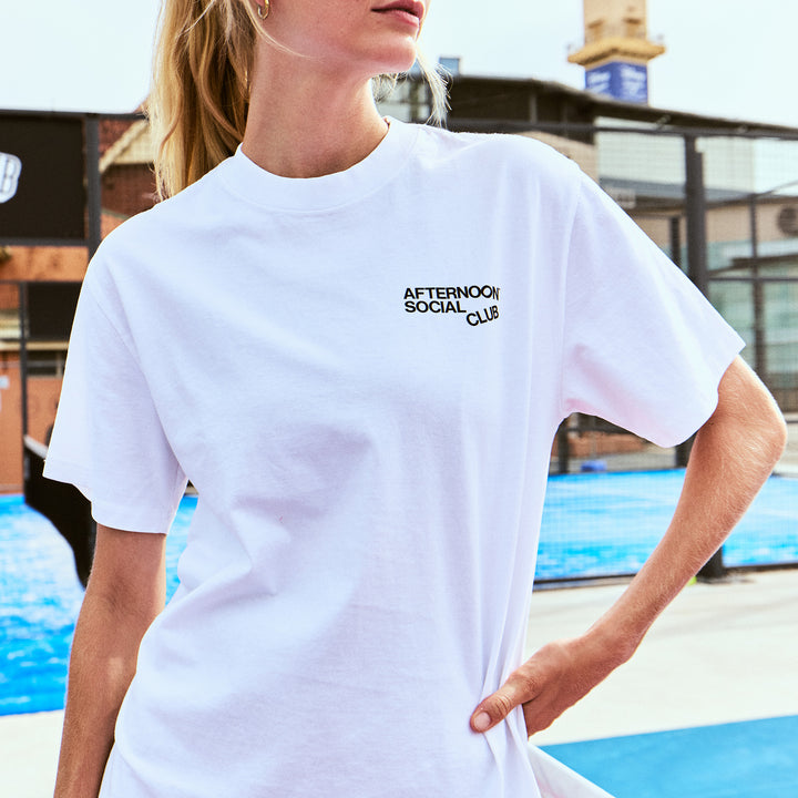 Female Model wearing a white Afternoon Social Club Heavy Tee