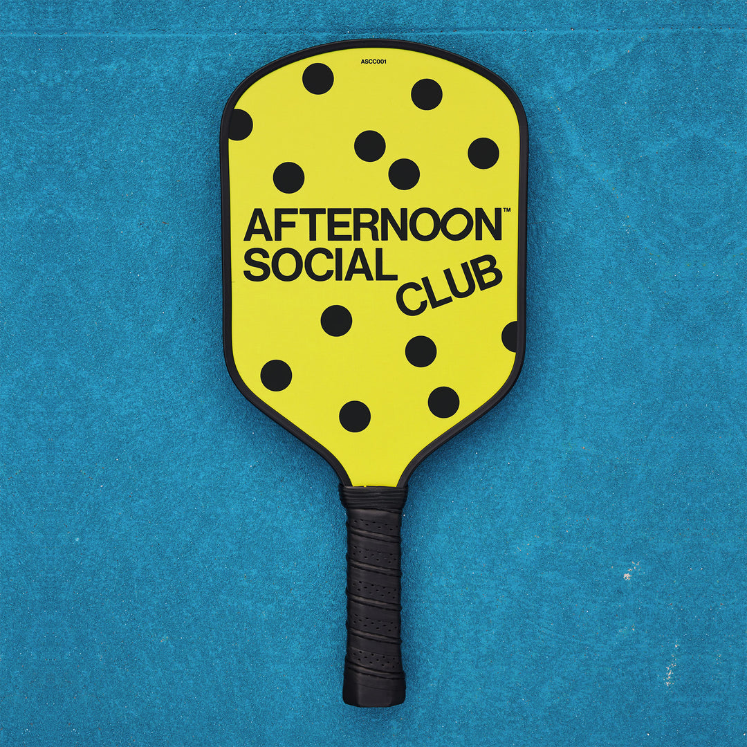 Yellow carbon Fiber Pickleball paddle with dots and afternoon social club logo